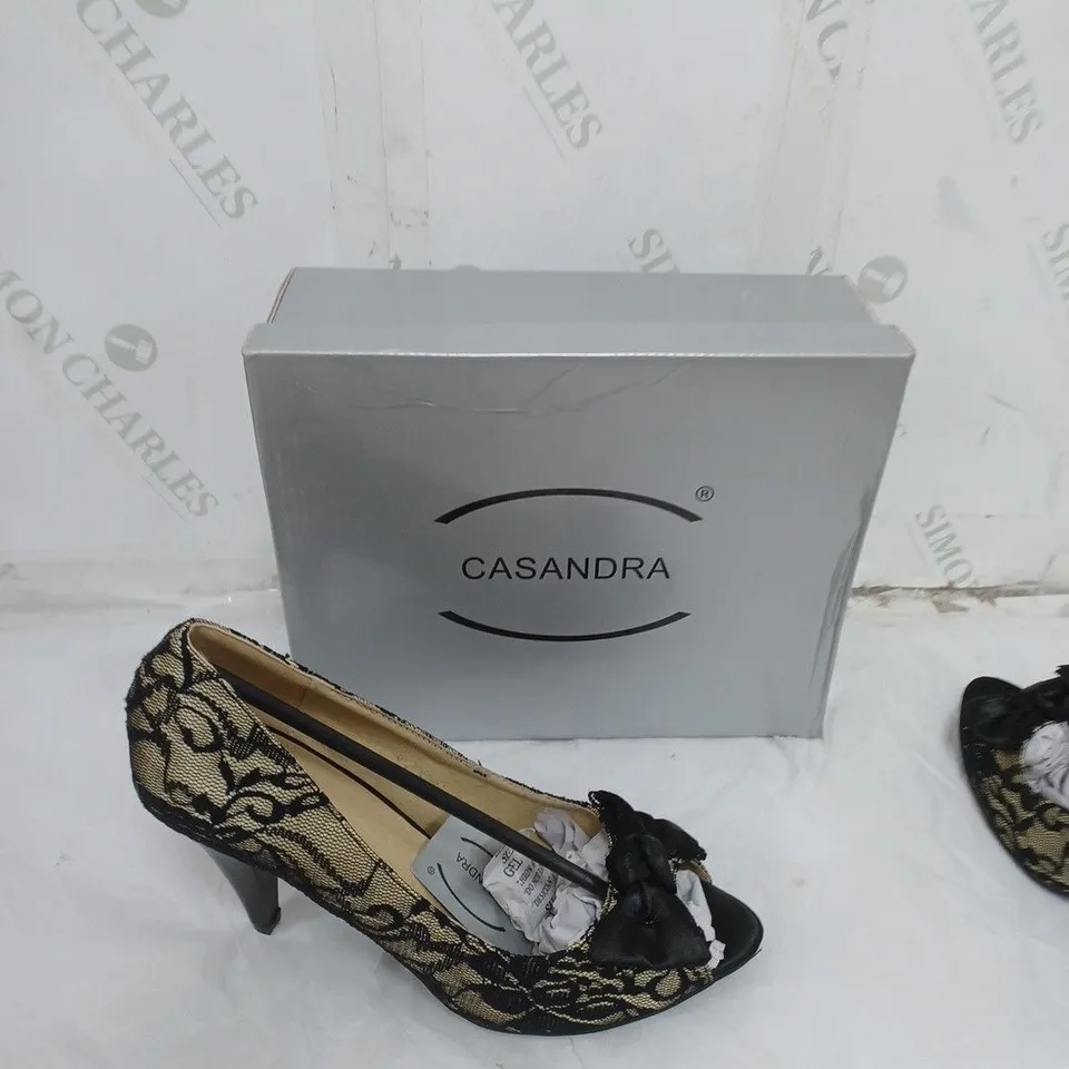 LARGE BOX OF BOXED APPROXIMATELY 10 CASSANDRA OPEN TOE HEELS IN BLACK/SAND IN VARIOUS SIZES