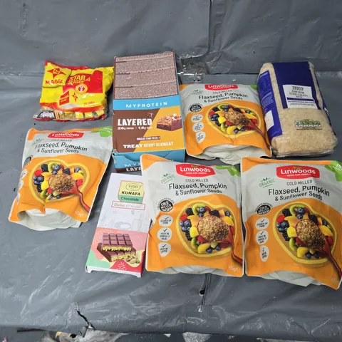 APPROXIMATELY 10 ASSORTED FOOD ITEMS TO INCLUDE MP LAYERED PEANUT BARS, LUNWOODS SEED MIXED, AND LONG GRAIN RICE ETC. 