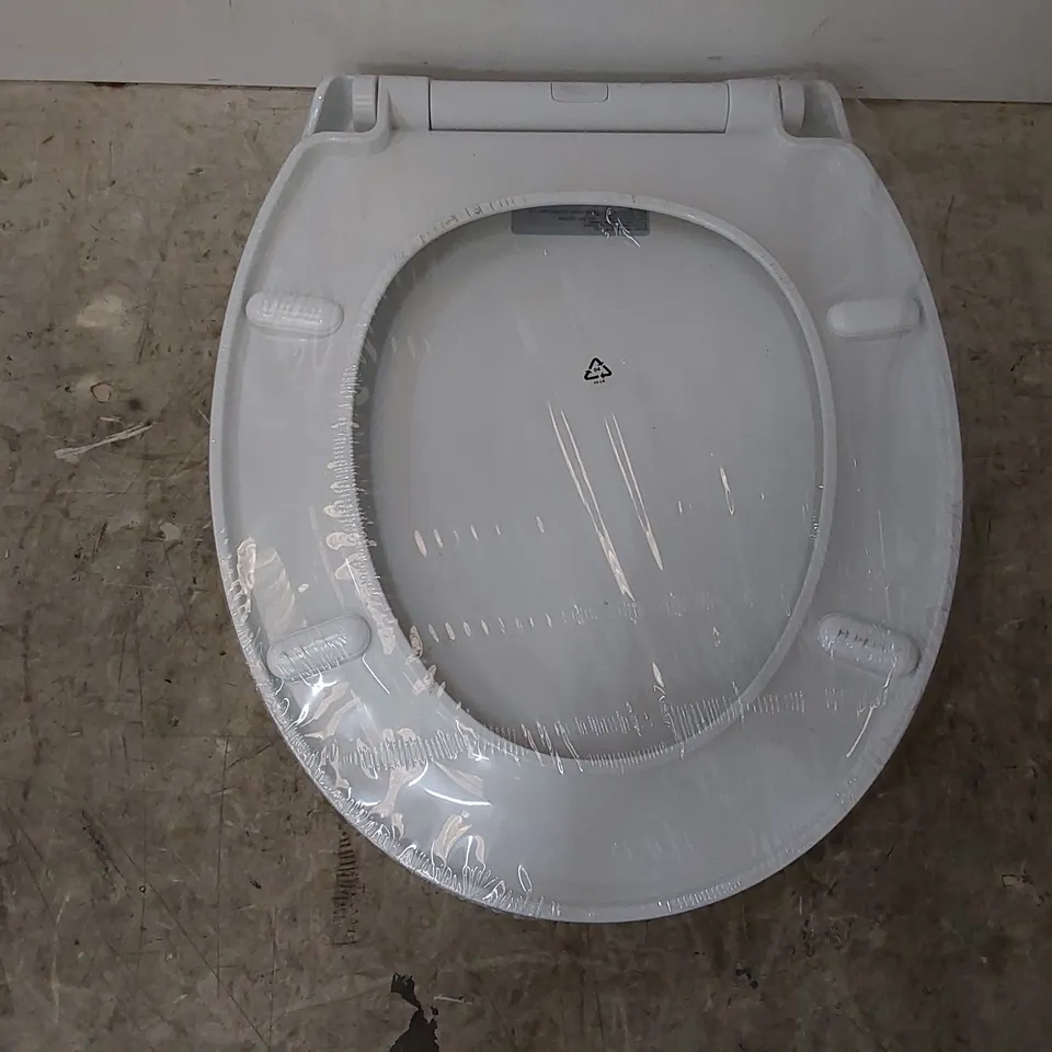 WRAPPED WHITE TOILET SEAT (1 ITEM)