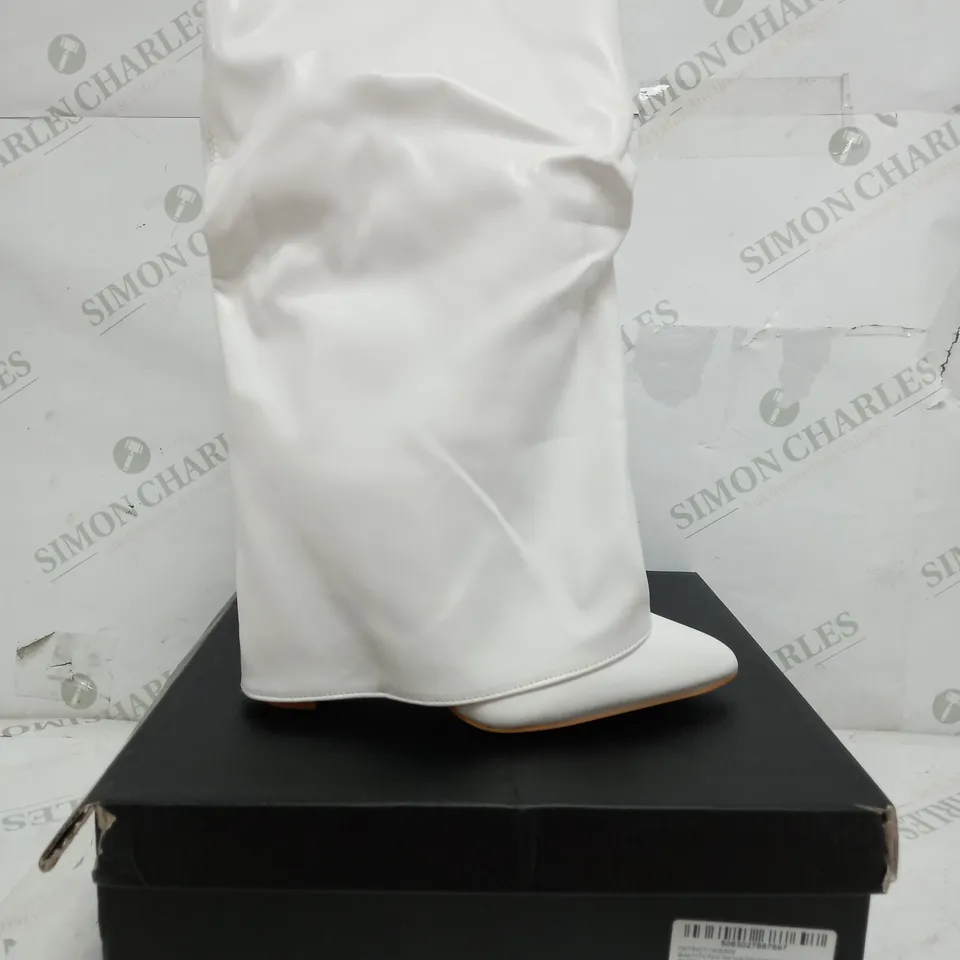 BOXED PAIR OF PRETTY LITTLE THINGS WIDE FIT POINT TOE OVER HIGH HEELED CALF BOOTS IN WHITE - UK 4