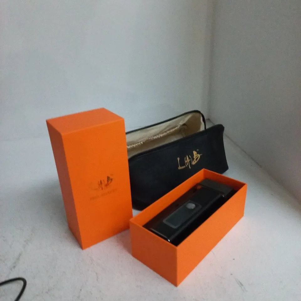 ORANGE BOXED ELECTRIC SHAVER WITH BLACK POUCH (LMB)