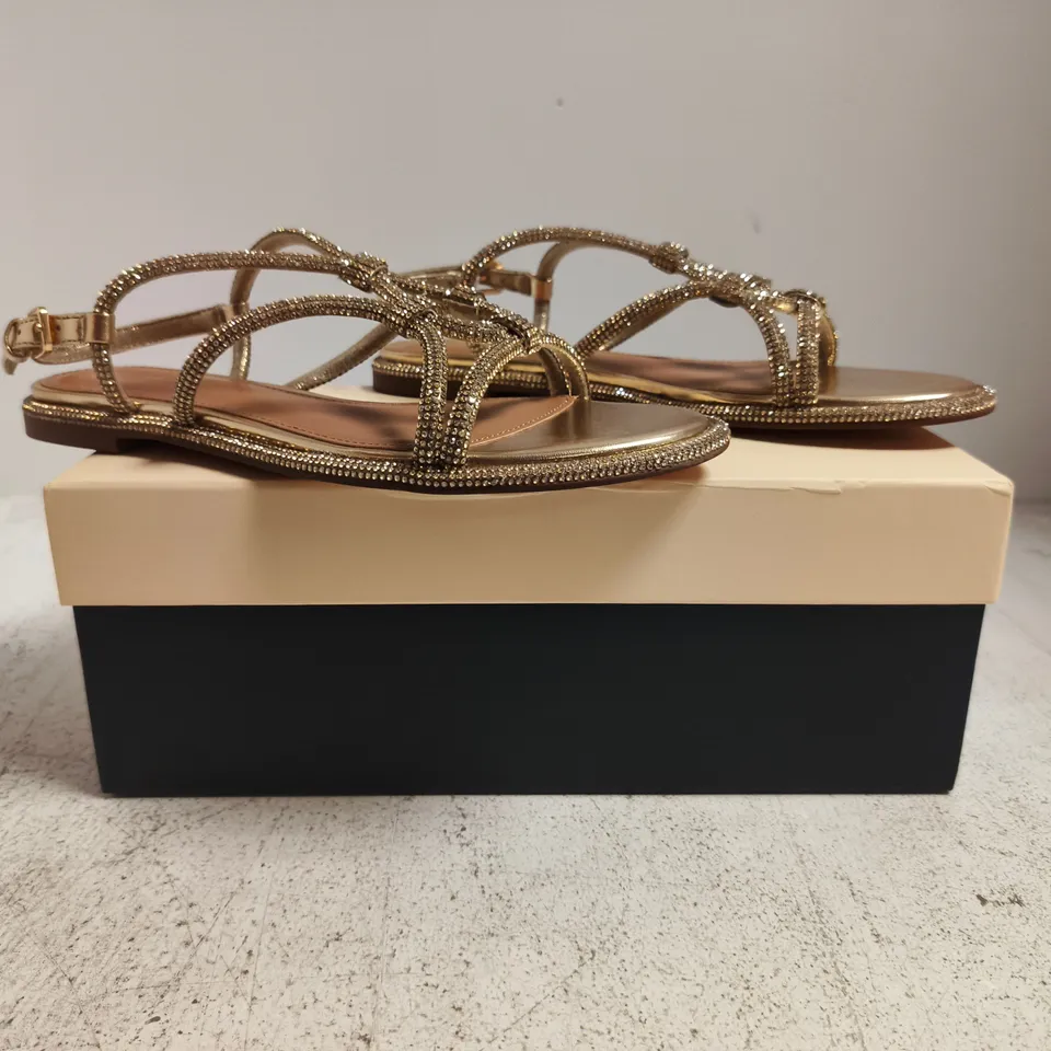BOXED PAIR OF KURT GEIGER ROONIE OPEN TOE FLAT SANDALS IN GOLD W. JEWEL DETAIL SIZE EU 37