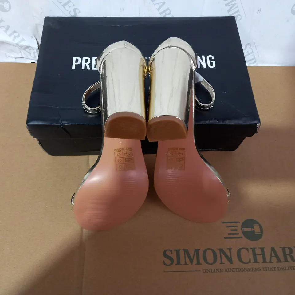 BOXED PAIR OF PRETTY LITTLE THING GOLD HIGH HEELS SIZE 6