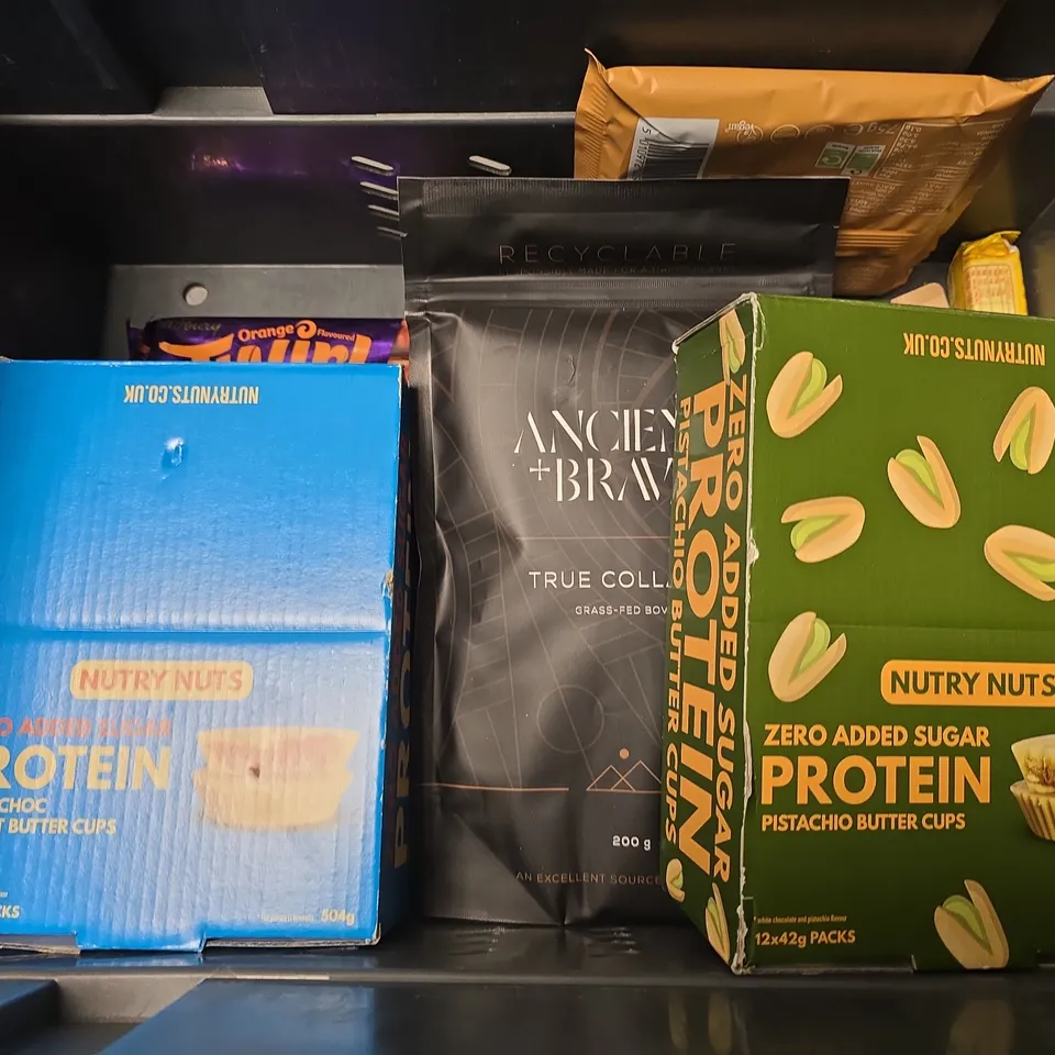 APPROXIMATELY 8 ASSORTED FOOD ITEMS TO INCLUDE - SKITTLES WILD BERRY , NUTRY NUTS PISTACHIO BUTTER CUPS ETC