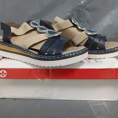 BOXED PAIR OF RIEKER SANDALS IN NAVY SIZE 6