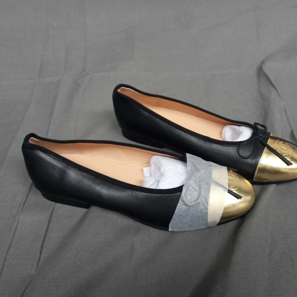 UNBOXED PAIR OF CHANEL SIZE 37C SLIP ON PUMPS IN BLACK/GOLD