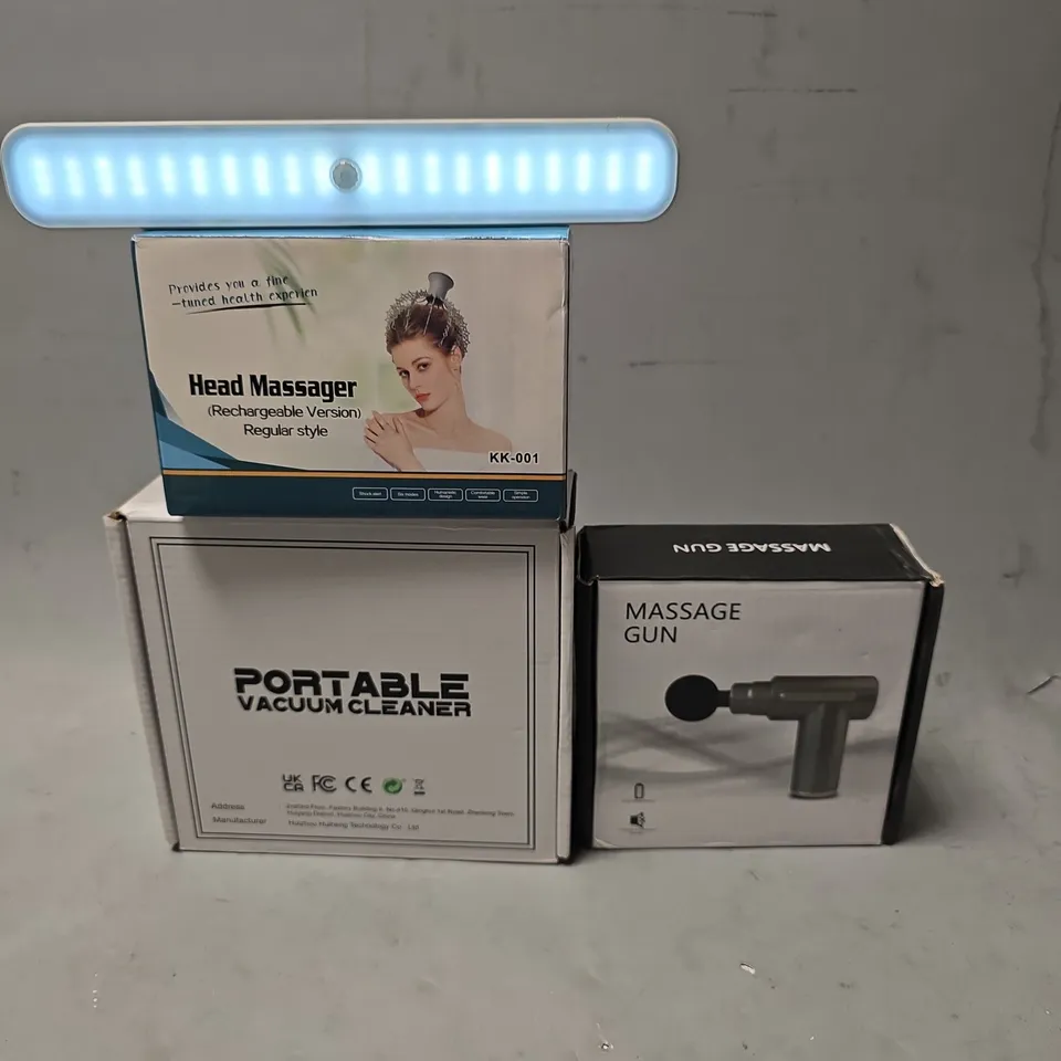 APPROXIMATELY 5 ASSORTED ITEMS TO INCLUDE - MASSAGE GUN , PORTABLE VACUUM CLEANER ETC