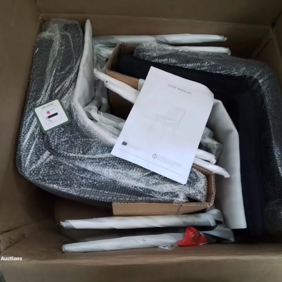 A BOXED SET OF 4 VELVET UPHOLSTERED DINING ROOM CHAIRS IN BLACK