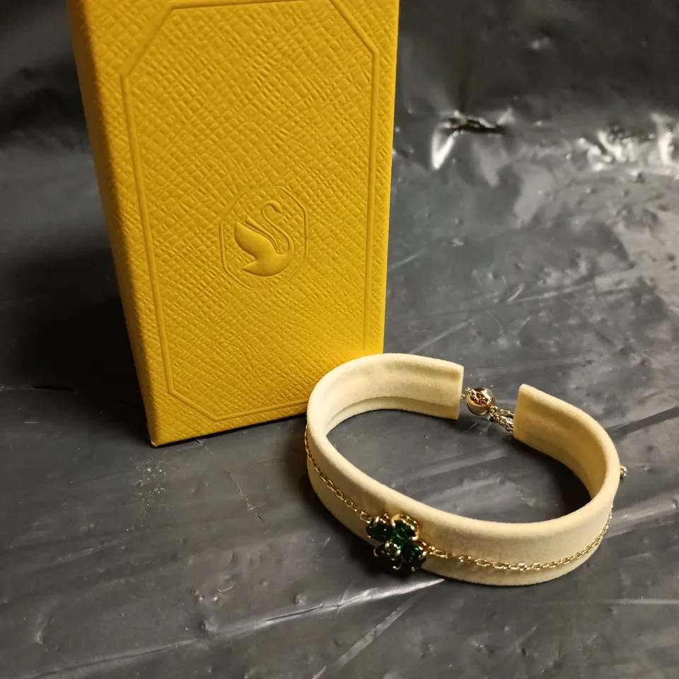 SWAROVSKI IDYLLIA GOLD TONED GREEN CLOVER TOGGLE BRACELET