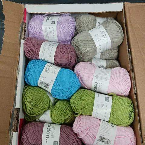 APPROXIMATELY 25 RICO CREATIVE COTTON ARAN YARN IN ASSORTED COLOURS 