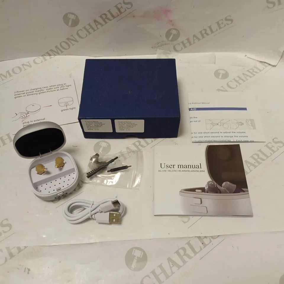 BOXED IN-EAR HEARING AID WITH CHARGING CASE, ACCESSORIES, USB CABLE AND INSTRUCTIONS