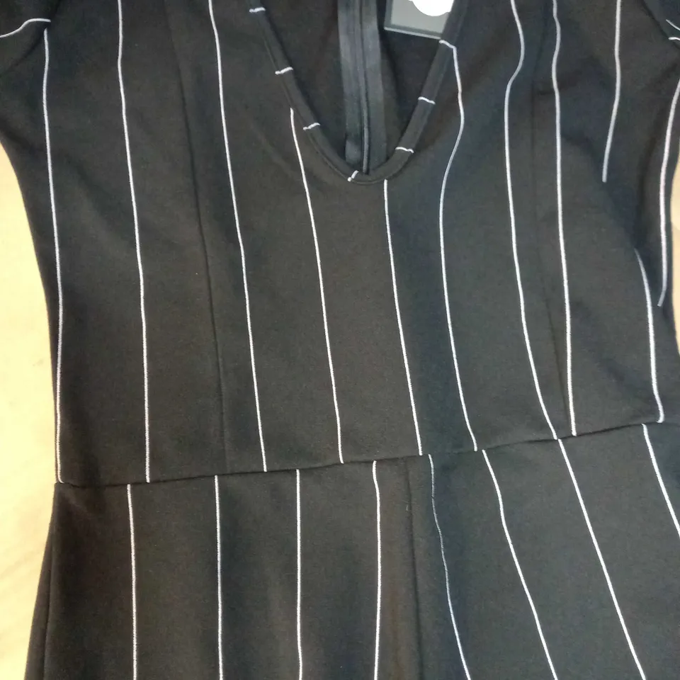 DESIGNER BLACK/WHITE STRIPED FLARED SLEEVED JUMPSUIT - SIZE 12