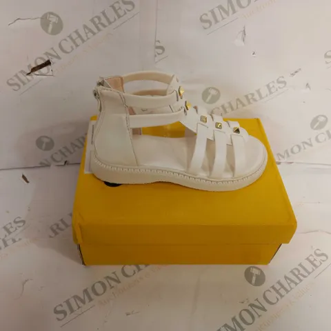 BOXED PAIR OF DESIGNER REAR-ZIPPED SANDALS IN CREAM - SIZE UNSPECIFIED