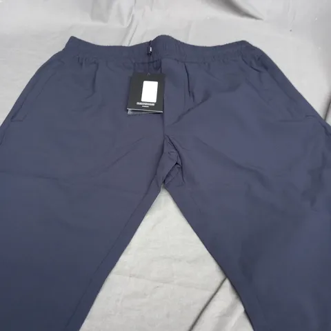 ARNE ACTIVE TECHNICAL TAPERED TRACKPANTS IN NAVY - MEDIUM