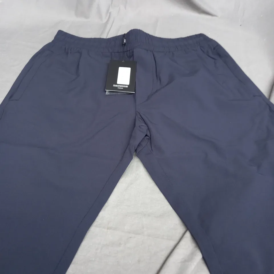ARNE ACTIVE TECHNICAL TAPERED TRACKPANTS IN NAVY - MEDIUM