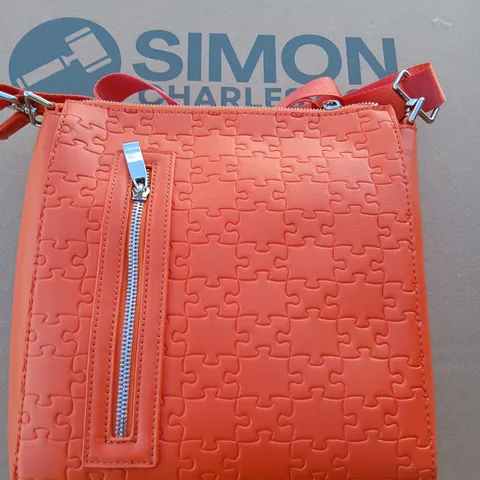 APPROXIMATELY FIVE DANIEL DIYEPRIYE PUZZLE-PATTERN HANDBAG WITH FRONT ZIP POCKET AND CROSSBODY STRAP 