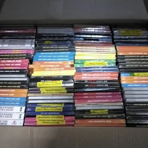 APPROXIMATELY 100 ASSORTED CDS AND DVDS TO INCLUDE NOW MUSIC 18, NOW YEARBOOK, AND NOW THAT'S WHAT I CALL ETC.