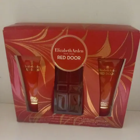 BOXED ELIZABETH ARDEN RED DOOR GIFT SET TO INCLUDE; PERFUMED BODY LOTION, EAU DE TOILETTE AND BATH/SHOWER GEL