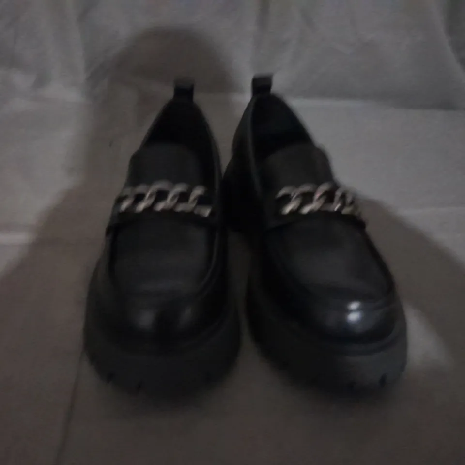 PAIR OF KOI SLIP ON SHOES IN BLACK SIZE 8 