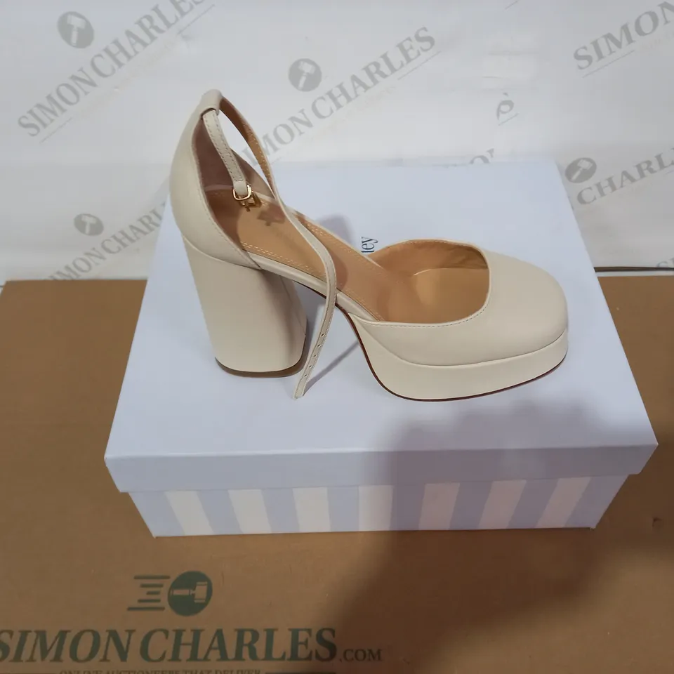 BOXED PAIR OF RUSSELL & BROMLEY CREAM HIGH HEELS SIZE 37