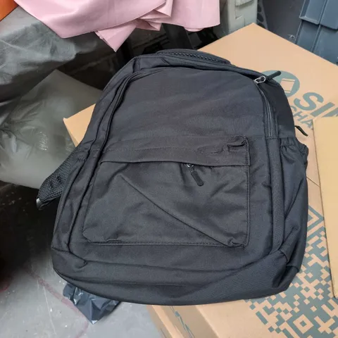 BLACK RUCKSACK WITH FRONT POCKET INCLUDED IN A BOX FULL OF ASSORTED HOUSEHOLD ITEMS.
