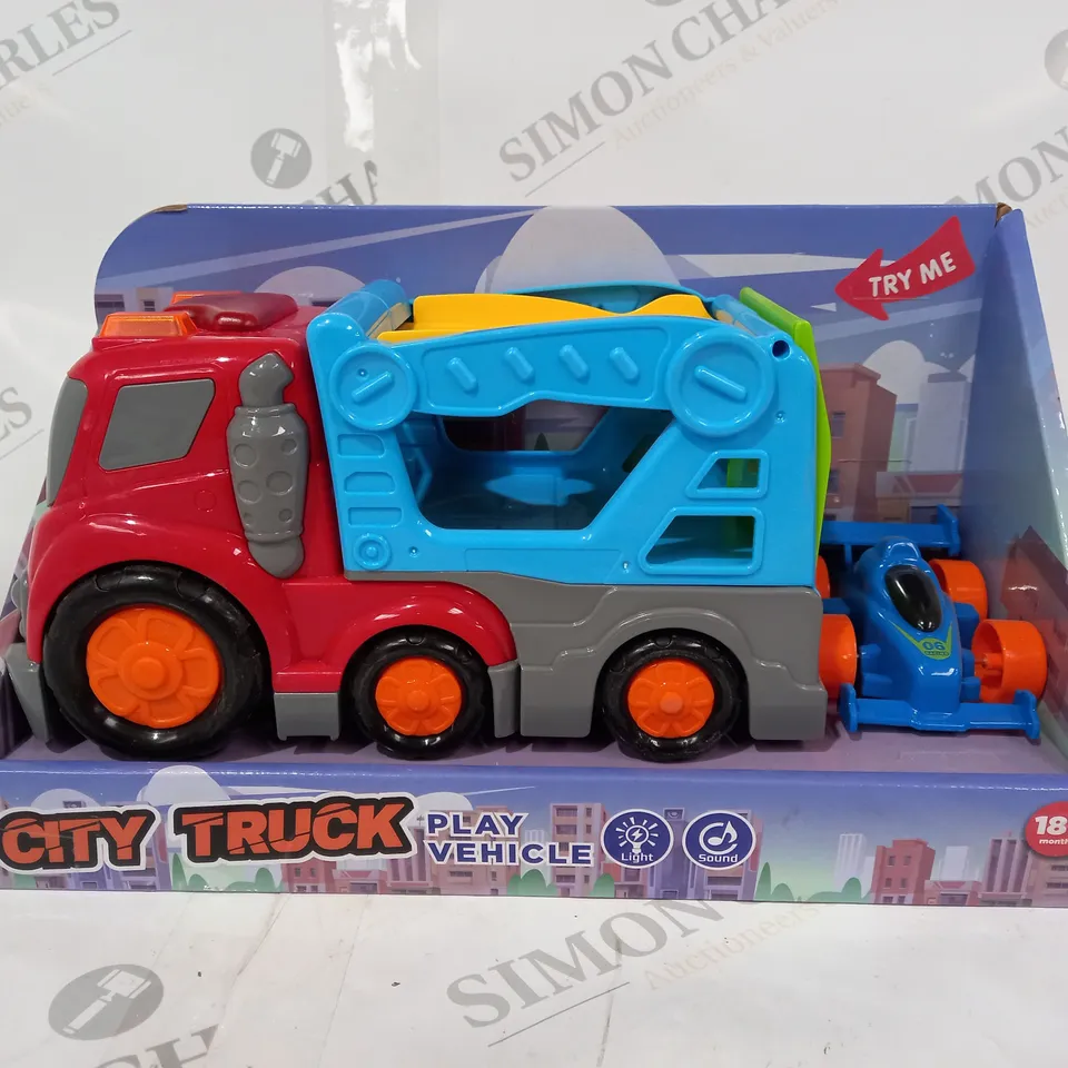 BOXED LIGHT UP CITY TRUCK WITH CAR 