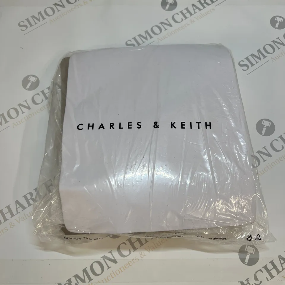 CHARLES & KEITH GABBINE SADDLE BAG IN CREAM SIZE S