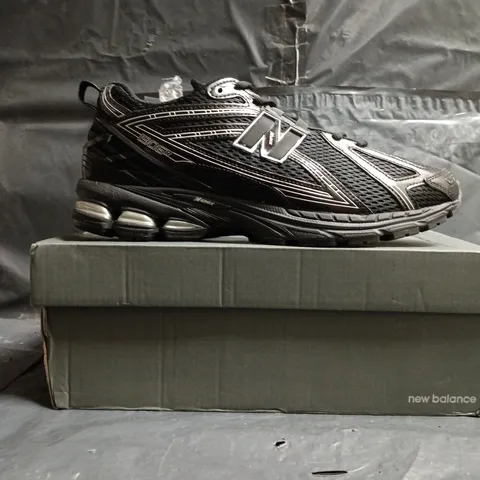 BOXED PAIR OF NEW BALANCE 1906R TRAINERS IN BLACK SIZE UK 10