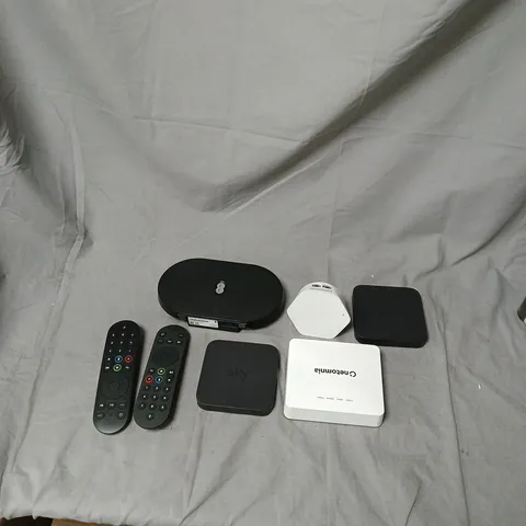 SKY TV SET-TOP BOX BUNDLE WITH REMOTES AND CABLES ASSORTED LEADS SKY REMOTES APPROXIMATELY 8 ITEMS .