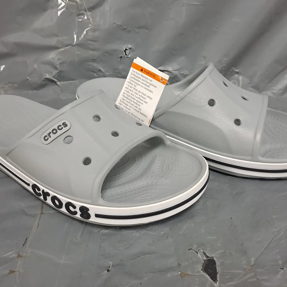 PAIR OF CROCS BAYABAND SLIDES IN GREY SIZE UK M8/W9