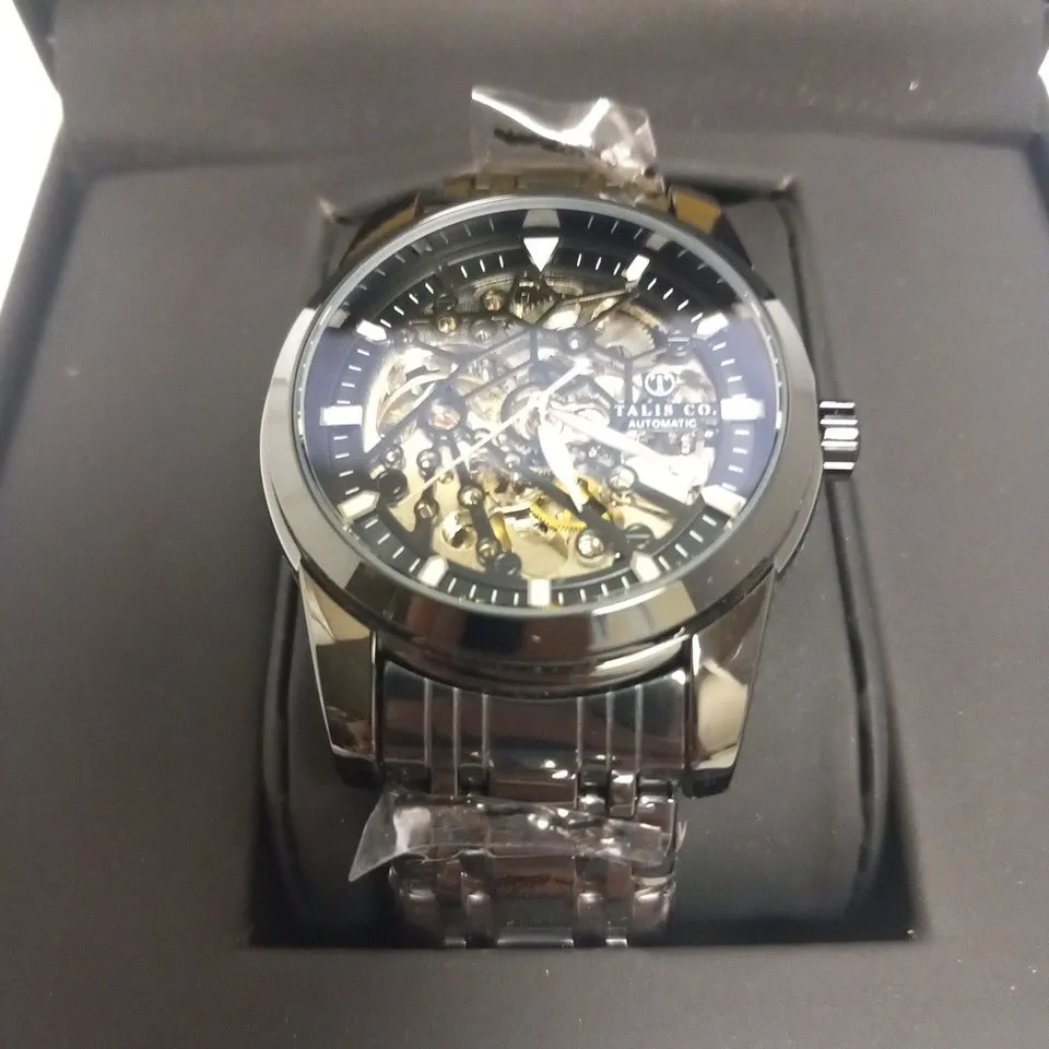 MEN’S TALIS CO 7820 AUTOMATIC WATCH – BLACK SKELETON DIAL AND CASE – STAINLESS STEEL STRAP – GLASS BACKCASE