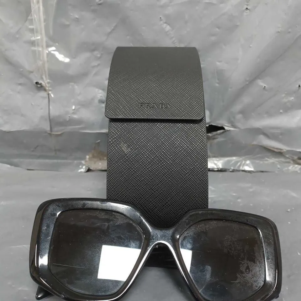 PRADA IRREGULAR SUNGLASSES IN BLACK