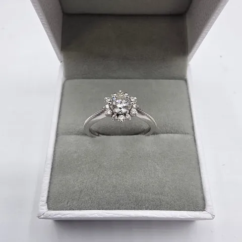 18CT WHITE GOLD RING SET WITH A NATURAL DIAMOND TO NATURAL DIAMOND HALO