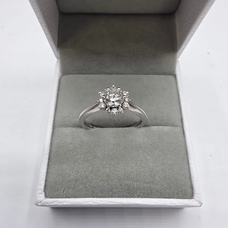 18CT WHITE GOLD RING SET WITH A NATURAL DIAMOND TO NATURAL DIAMOND HALO