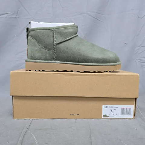 BOXED PAIR OF UGG CLASSIC ULTRA MINI SHOES IN GREEN SIZE UK 6