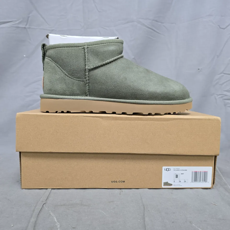 BOXED PAIR OF UGG CLASSIC ULTRA MINI SHOES IN GREEN SIZE UK 6