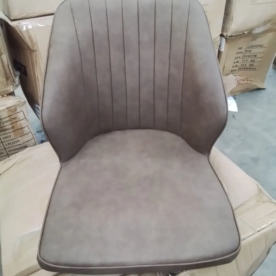 A BOXED PAIR OF BROWN FAUX LEATHER UPHOLSTERED SIDE CHAIRS 