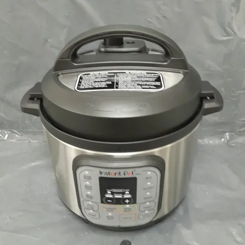 BOXED INSTANT POT DUO MULTI-USE PRESSURE COOKER