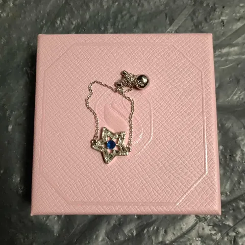 SWAROVSKI CRYSTAL STAR PENDANT BRACELET WITH BLUE CENTRE STONE