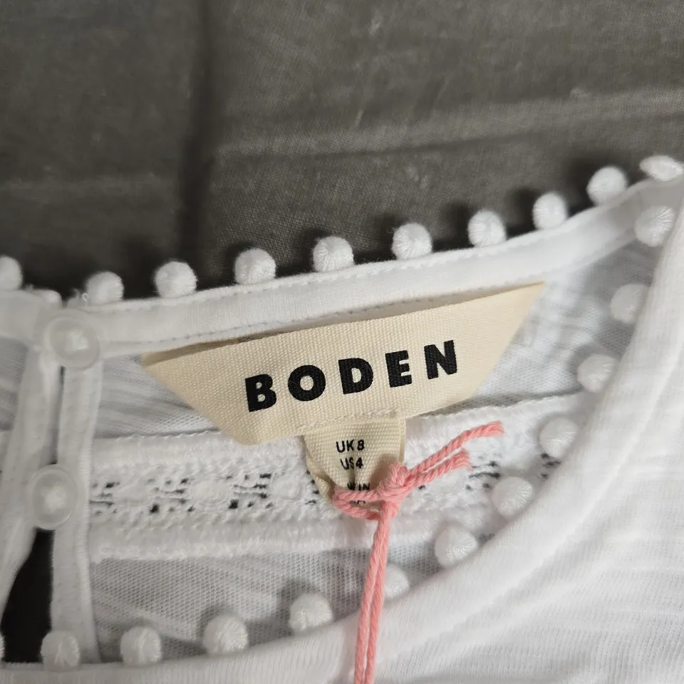 BODEN WHITE SHORT-SLEEVE TOP, UK 8 (US 4) – EYELET LACE & POM-POM TRIM