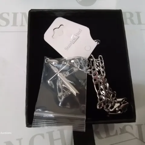 BOXED STERLING SILVER CROSS AND STAINLESS STEEL CHAIN.