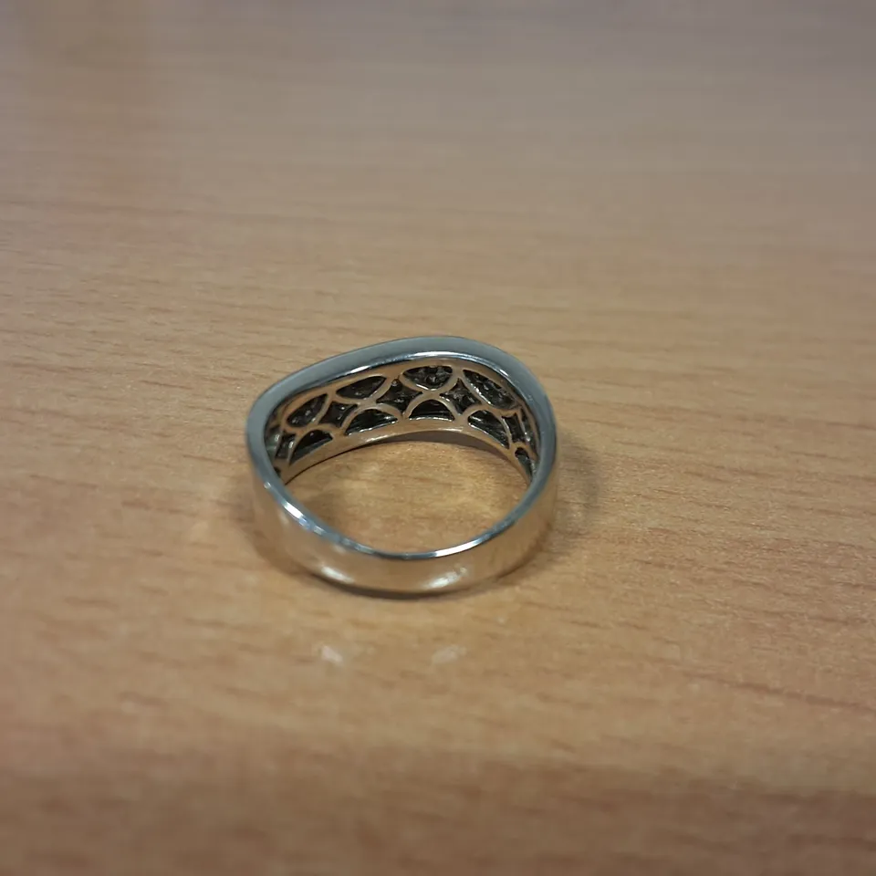 18CT WHITE GOLD WAVE RING SET WITH NATURAL DIAMONDS