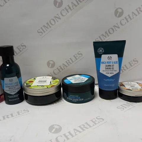 LOT OF 7 ASSORTED THE BODY SHOP PRODUCTS TO INCLUDE VITAMIN E HYDRATING TONER, AVOCADO BODY BUTTER, MENS SHAVING GEL, ETC