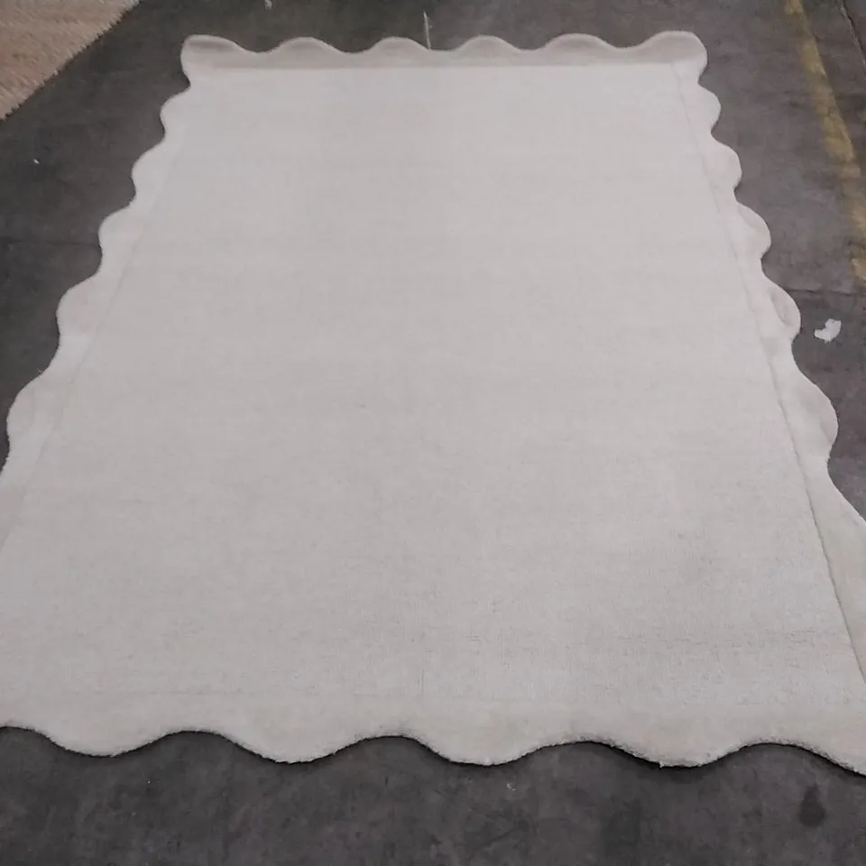 STILLAGE OF APPROXIMATELY 40 ESIGNER RUGS