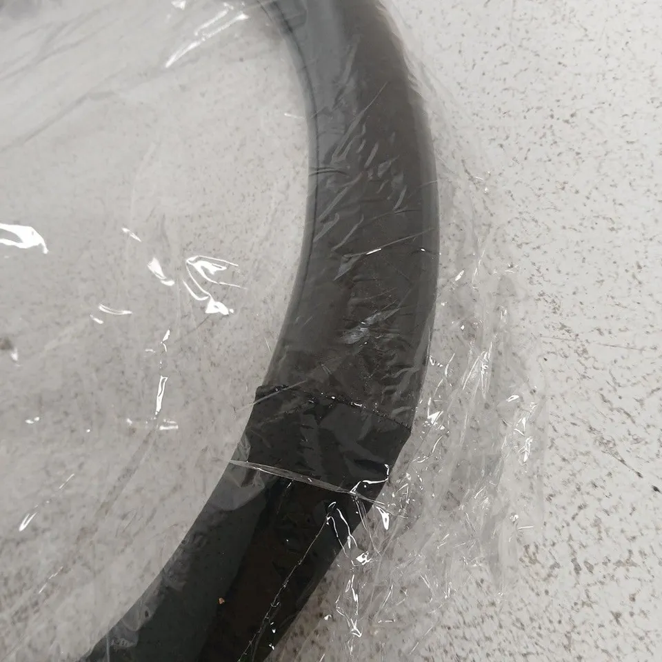 Black circular steering wheel cover – new in packaging
