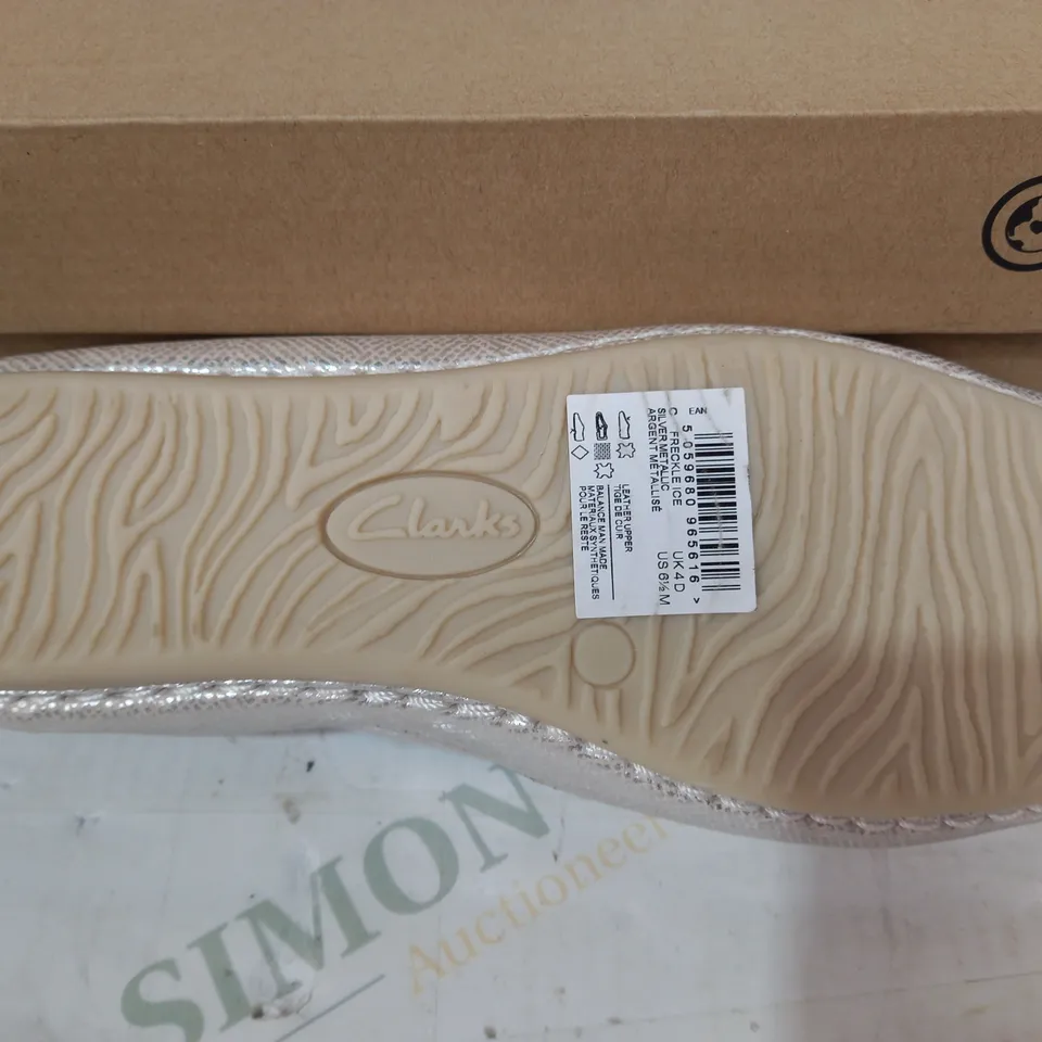 BOXED PAIR OF CLARKS FRECKLE ICE SLIP-ON SHOES IN METALLIC SILVER UK SIZE 4