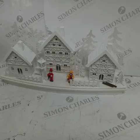 WHITE WOOD LIT VILLAGE SCENE