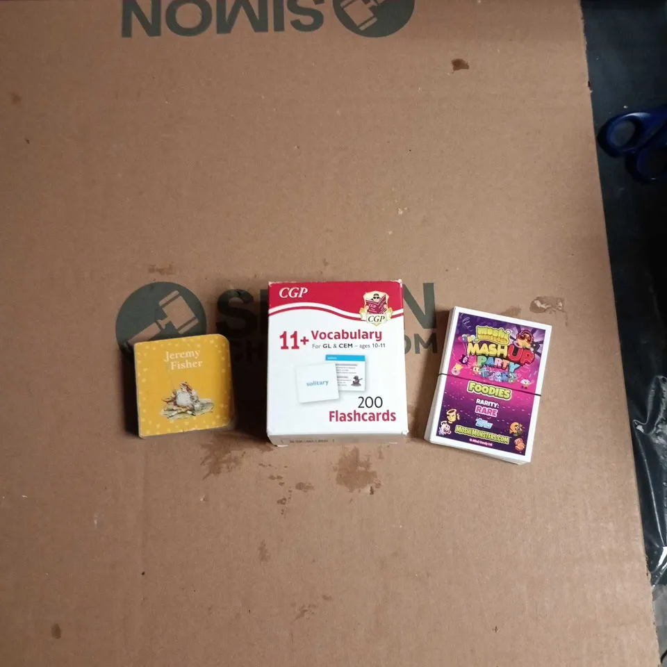 LARGE QUANTITY OF ASSORTED TOYS AND GAMES TO INCLUDE - KIDS BOOK, VOCAB CARDS & MOSHI MONTER TOPPS ETC
