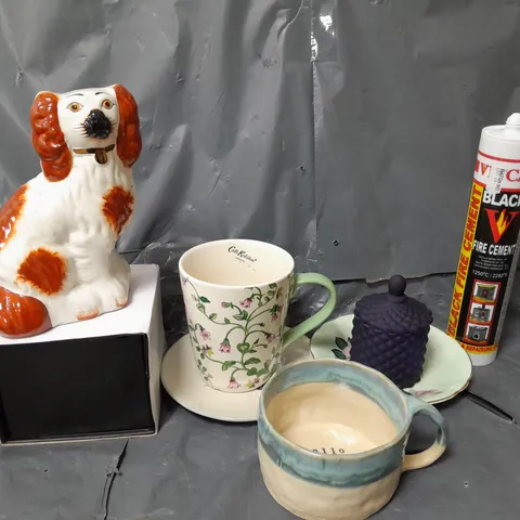 APPROXIMATELY 12 ASSORTED HOUSEHOLD ITEMS TO INCLUDE DOG ORNAMENT, MUG, BLACK FIRE CEMENT, ETC - COLLECTION ONLY