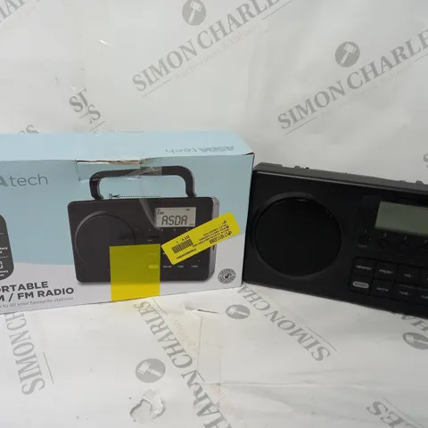 BOXED PORTABLE AM/FM RADIO IN BLACK